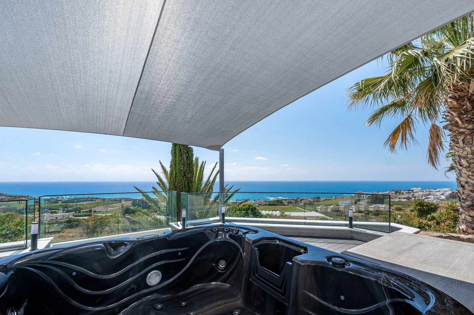 Luxury bungalow for sale in Kissonerga, Paphos. 5 bedrooms, 3 bathrooms, panoramic sea views, jacuzzi, private pool, landscaped gardens, close to Cora
