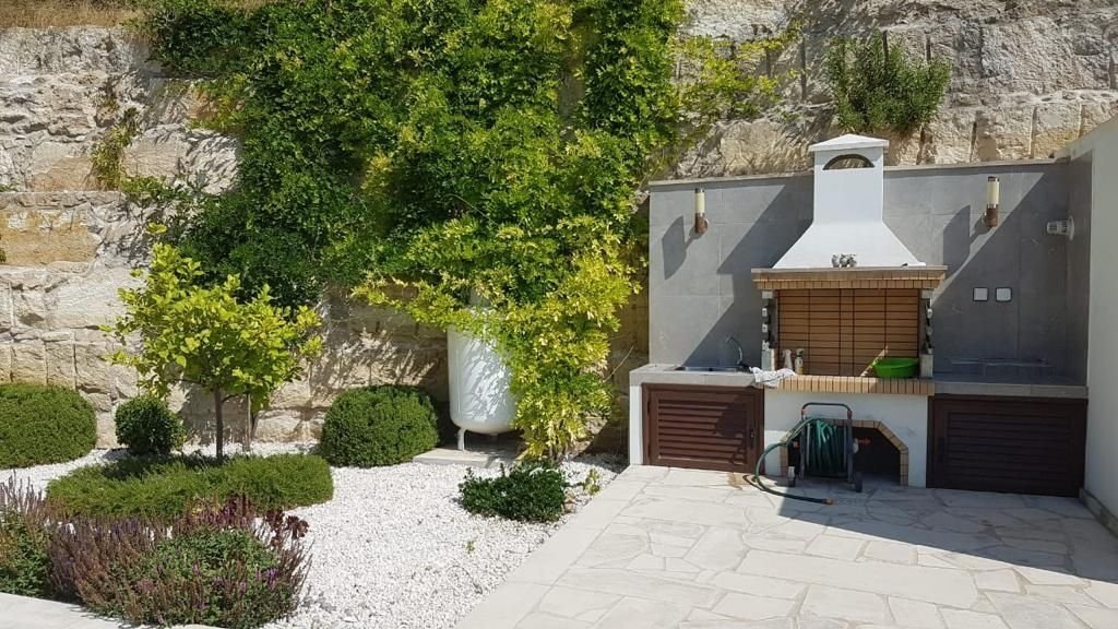 This villa is located in a quiet and picturesque area of Paphos in Tala Village. Tala village centre is a short walk away and offers a selection of ca