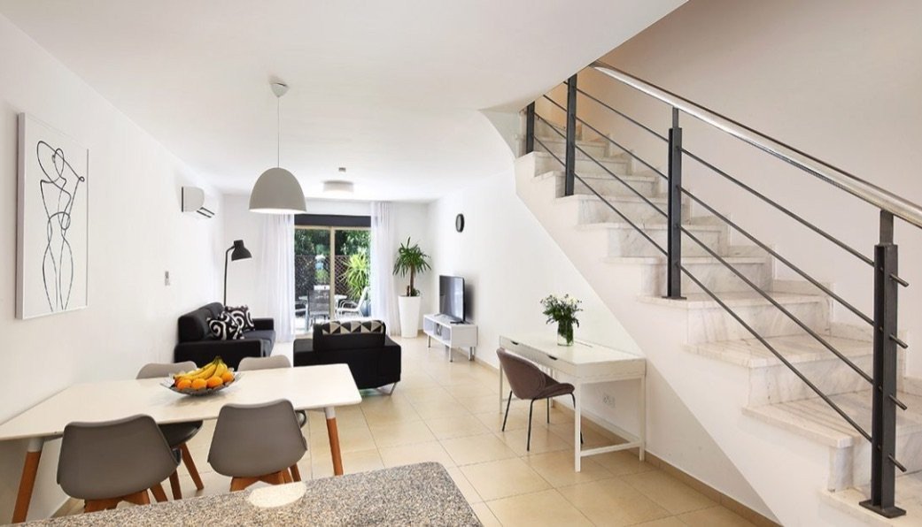 Beautifully finished and modern in style, this two bedroom townhouse features an open plan living/dining area & kitchen separated by the breakfast ...