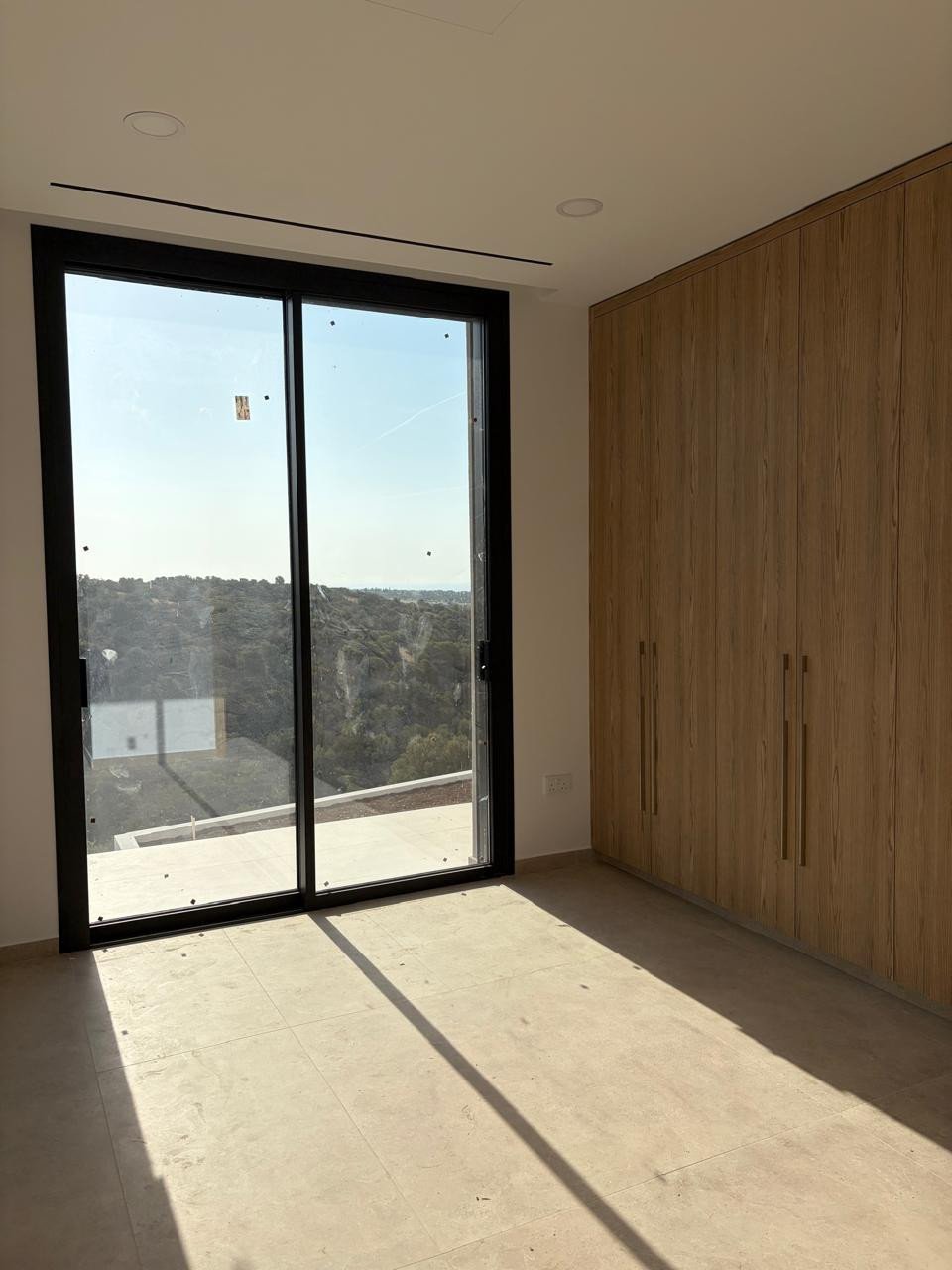 For sale is a stunning, modern bungalow located in the prestigious area of Kouklia - Aphrodite Hills. This key ready home offers spacious living on on