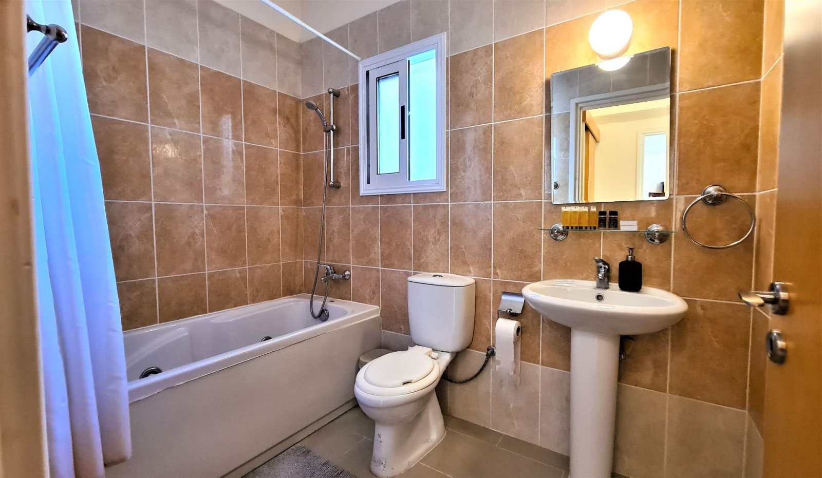 For Sale apartment on first floor near all amenities and the venues beach.