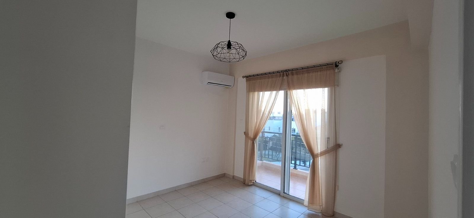 For sale is a well-maintained one-bedroom, one-bathroom apartment in Geroskipou. This resale property is situated on the top floor of a charming block