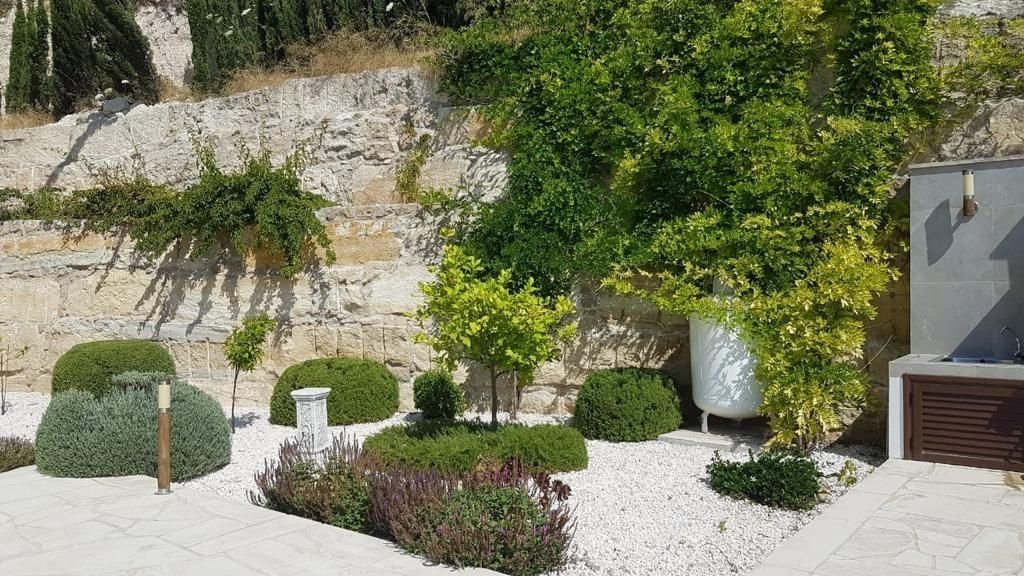 This villa is located in a quiet and picturesque area of Paphos in Tala Village. Tala village centre is a short walk away and offers a selection of ca