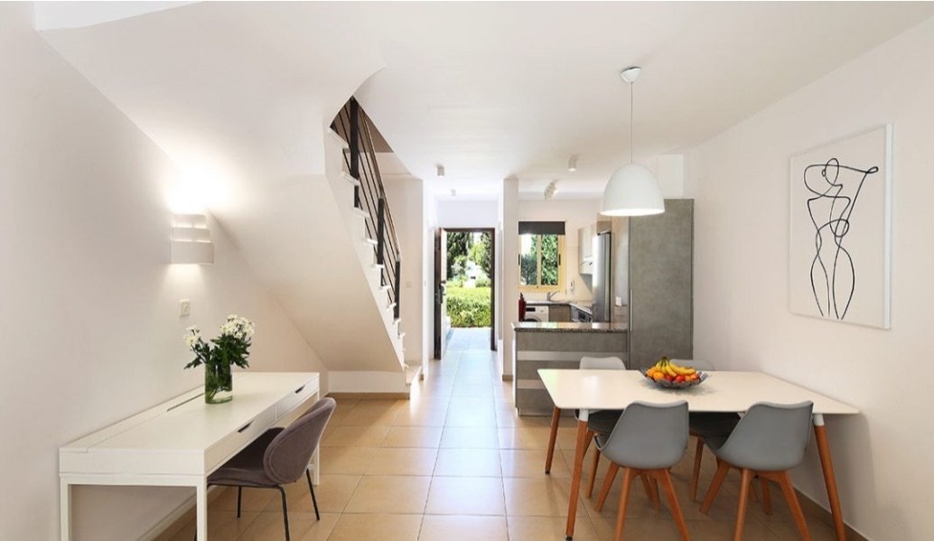 Beautifully finished and modern in style, this two bedroom townhouse features an open plan living/dining area & kitchen separated by the breakfast bar