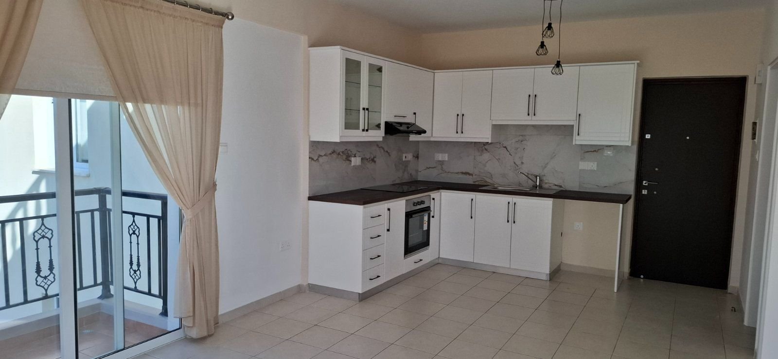 For sale is a well-maintained one-bedroom, one-bathroom apartment in Geroskipou. This resale property is situated on the top floor of a charming block