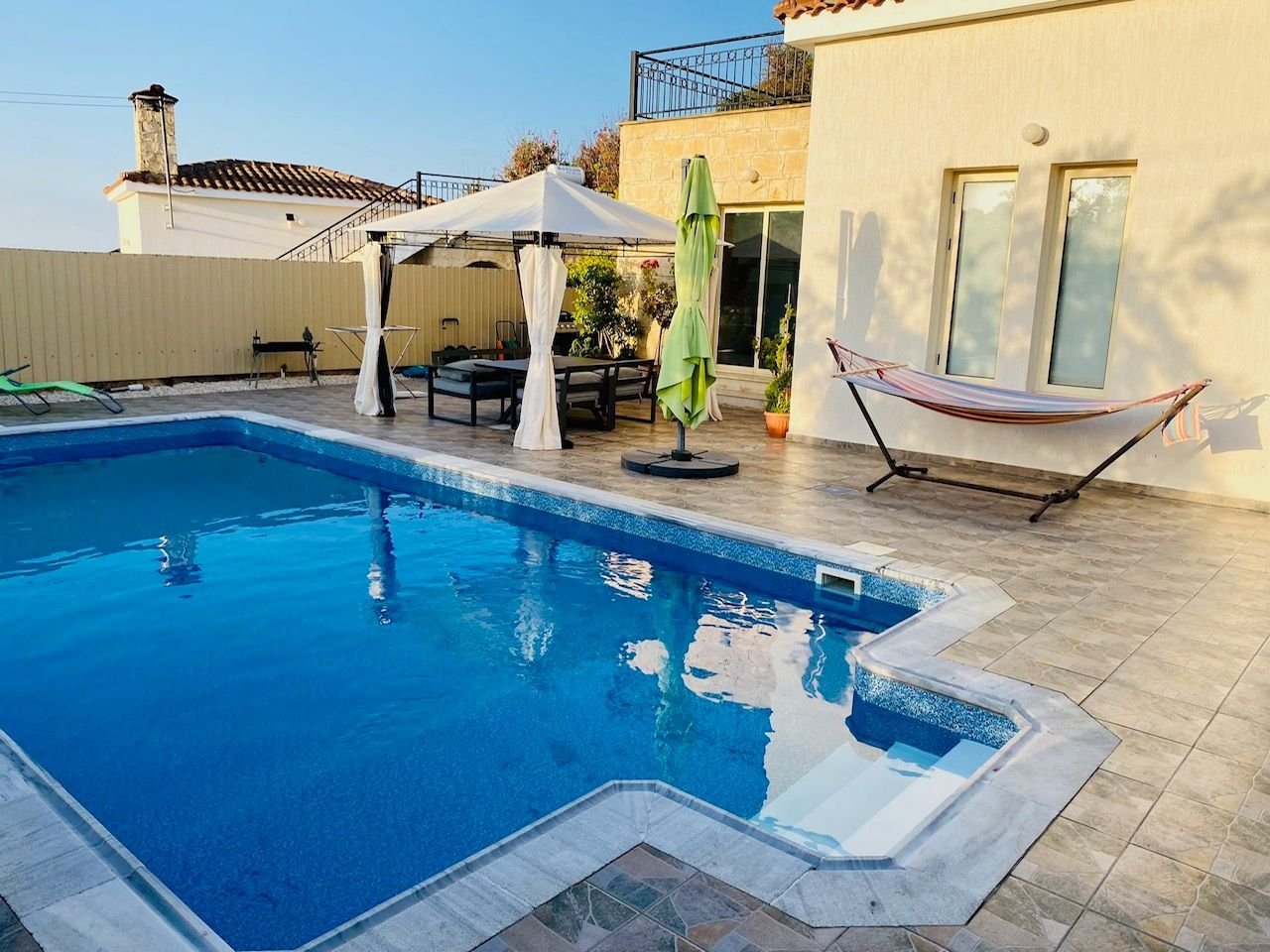 For sale is a charming bungalow located in the serene area of Kivides. This well-maintained resale property offers 119 m² of internal space, featuring