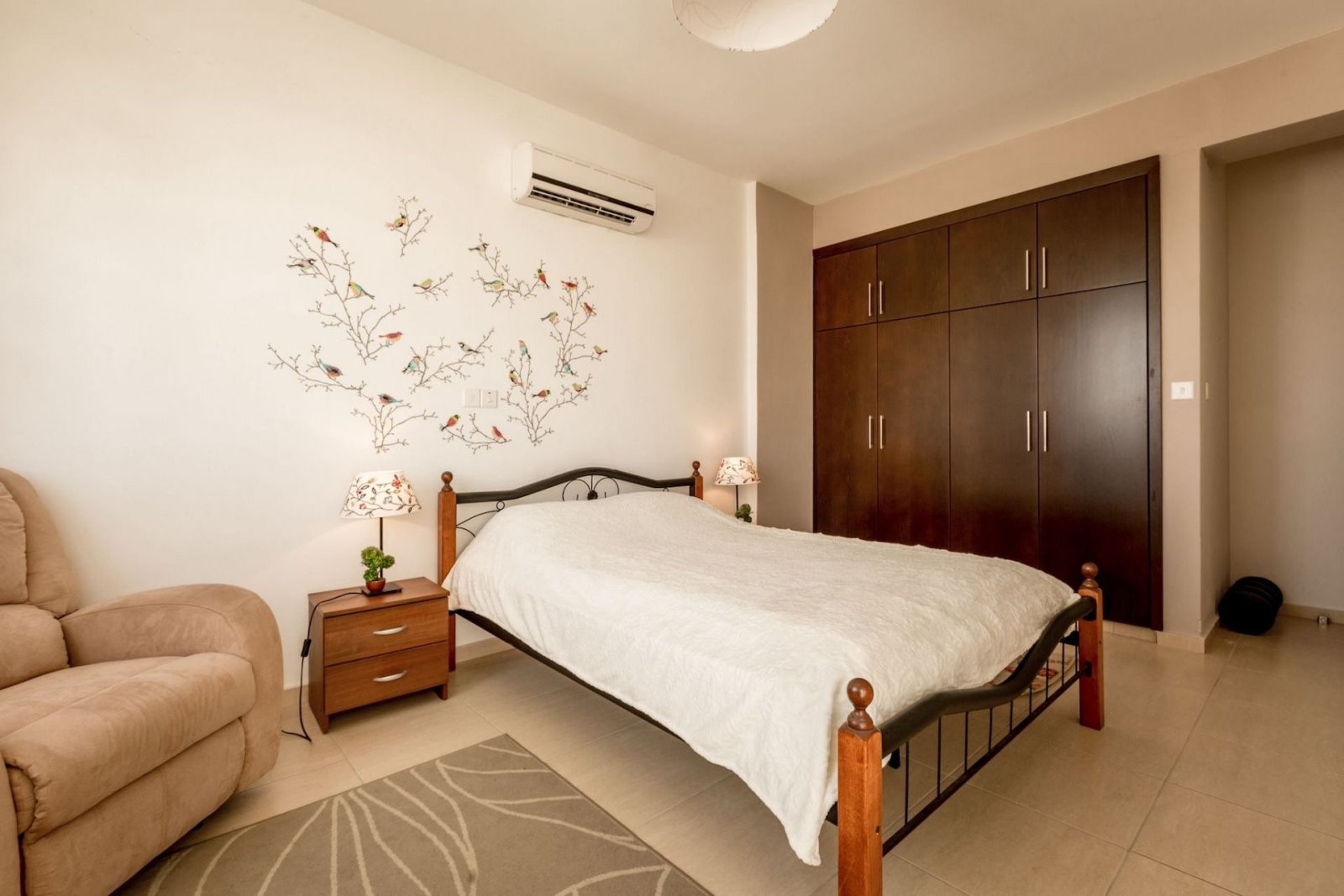 For sale is a spacious Top Floor three Bedroom Resale apartment located in the vibrant center of Paphos. This top-floor residence offers an internal s